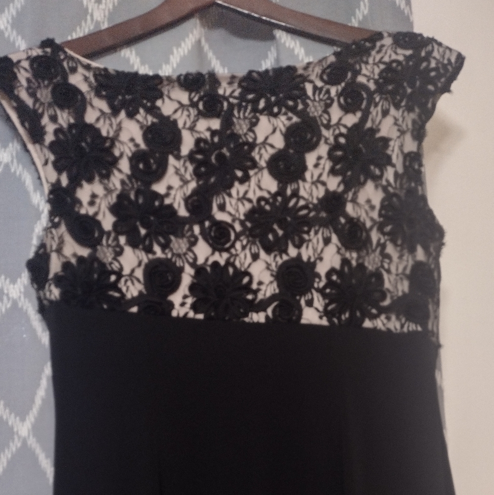 Elegant Sleeveless Black and Cream Floral Maxi Gown. Ruched Asymmetrical bodice.